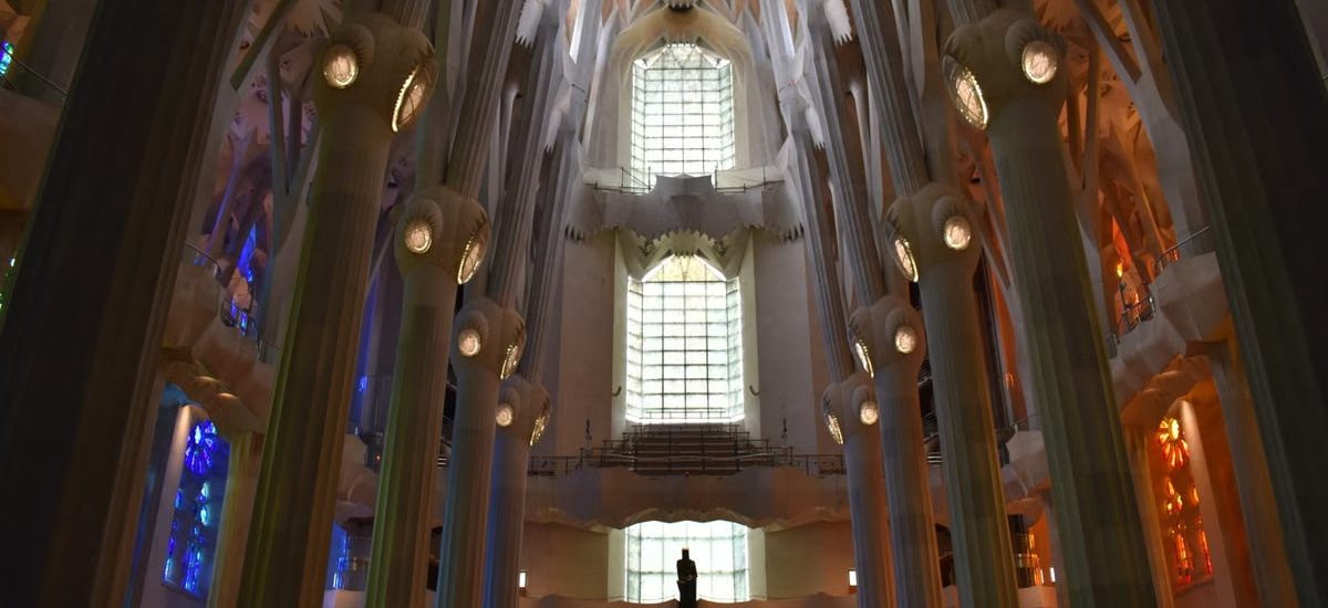 Stunning view of the La Sagrada Familia interior showcasing its unique architecture and stained glass.